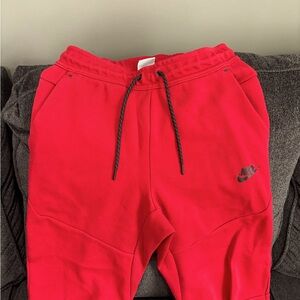 Nike tech joggers.  Mens size small Red